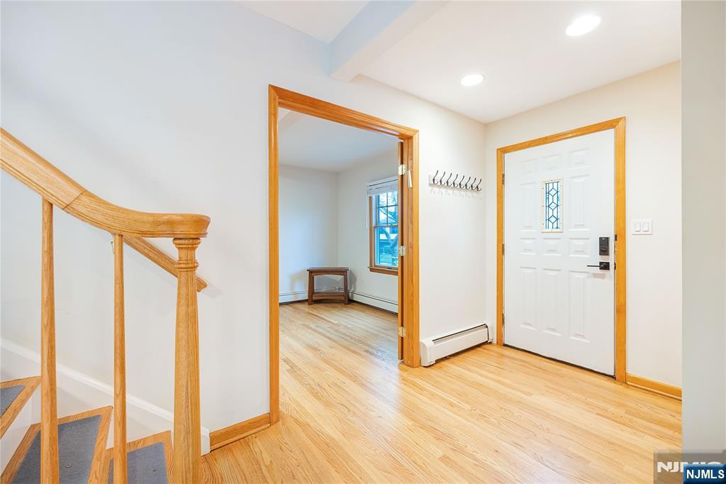 75 Columbus Drive Tenafly, NJ 07670 - Photo 3 of 26 a view of a hallway with wooden floor and entryway