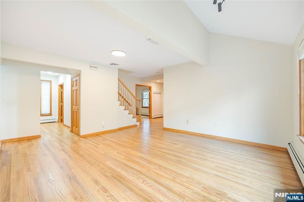 75 Columbus Drive Tenafly, NJ 07670 - Photo 6 of 26 a view of an empty room with wooden floor