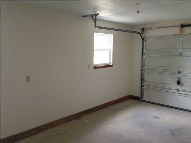 6018 Sand Hill Road Crestview, FL 32539 - Photo 3 of 11 a view of an empty room with a window