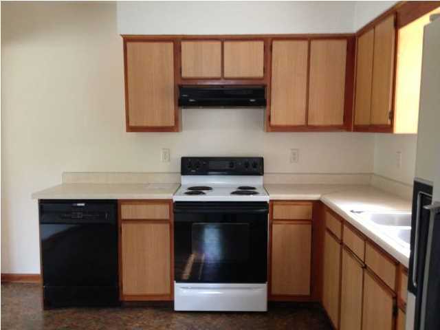 6018 Sand Hill Road Crestview, FL 32539 - Photo 6 of 11 a kitchen with stainless steel appliances granite countertop a stove a sink and a microwave