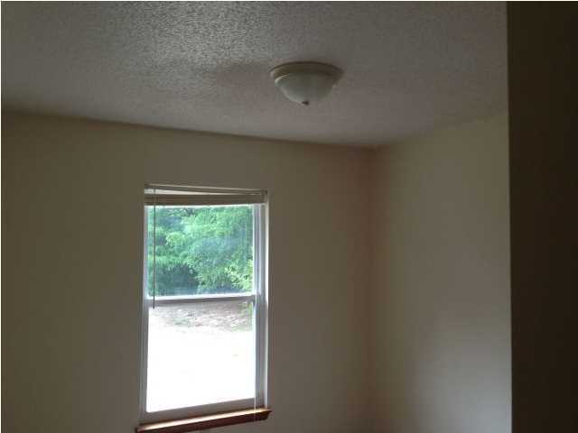 6018 Sand Hill Road Crestview, FL 32539 - Photo 7 of 11 a view of an empty room with a window