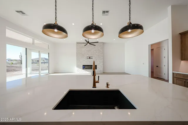 a kitchen with a counter space a sink and a window