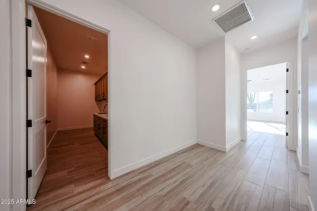 a kitchen with a stove and a wooden cabinets