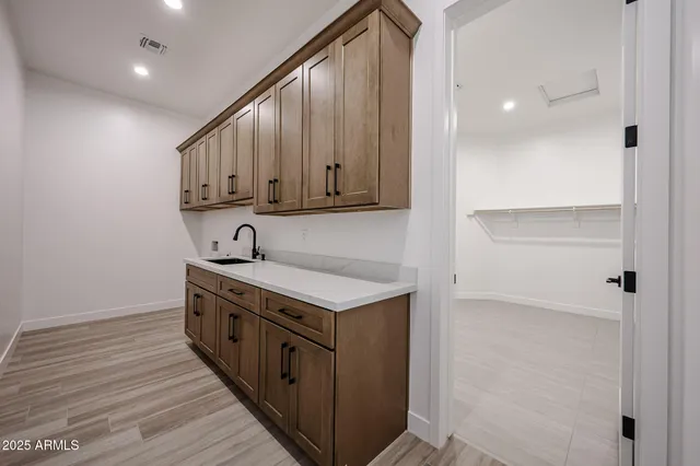 a bathroom with a double vanity sink mirror and