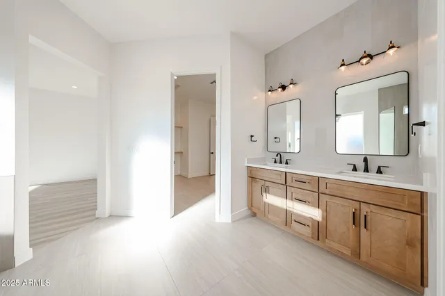 a view of a room with wooden floor and ceiling fan