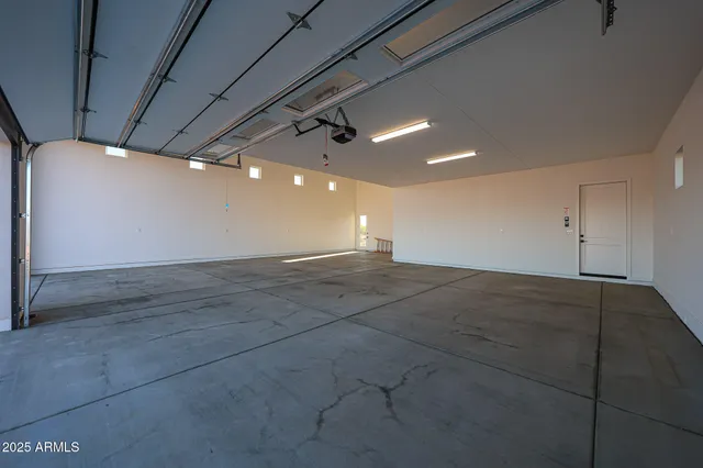 a view of a livingroom with wooden floor and chair