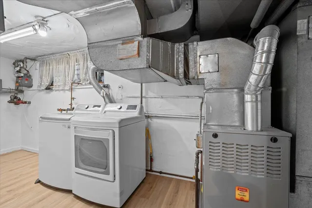 a view of an empty room with a closet and a window