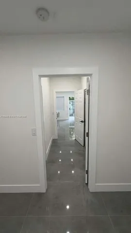 a view of hallway with livingroom