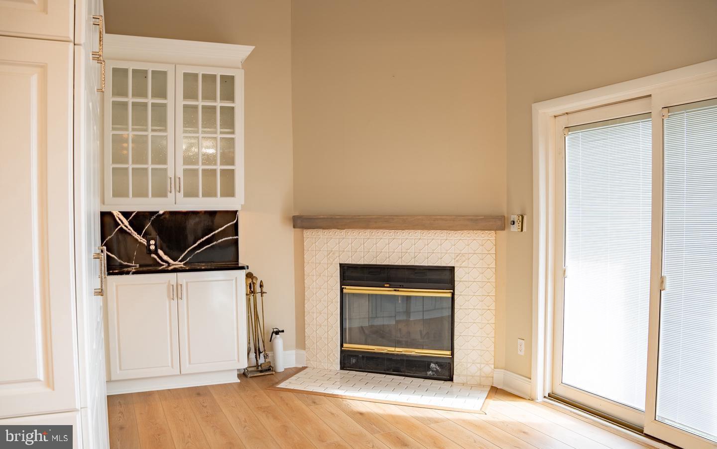 6907 Jones View Drive, Unit 3A Baltimore, MD 21209 - Photo 11 of 19 a view of an empty room with wooden floor and a window