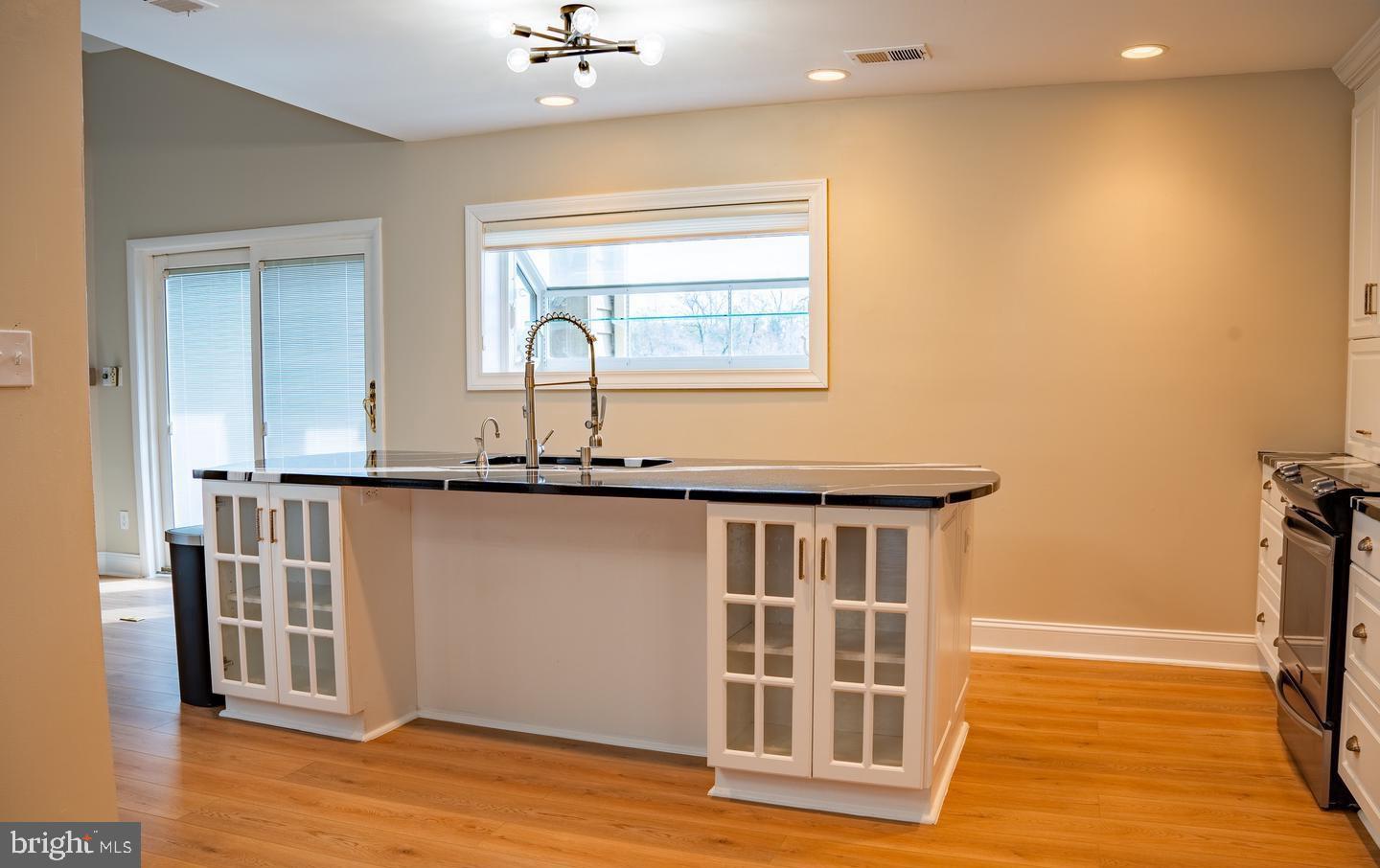 6907 Jones View Drive, Unit 3A Baltimore, MD 21209 - Photo 13 of 19 a view of a house with wooden floor and a window