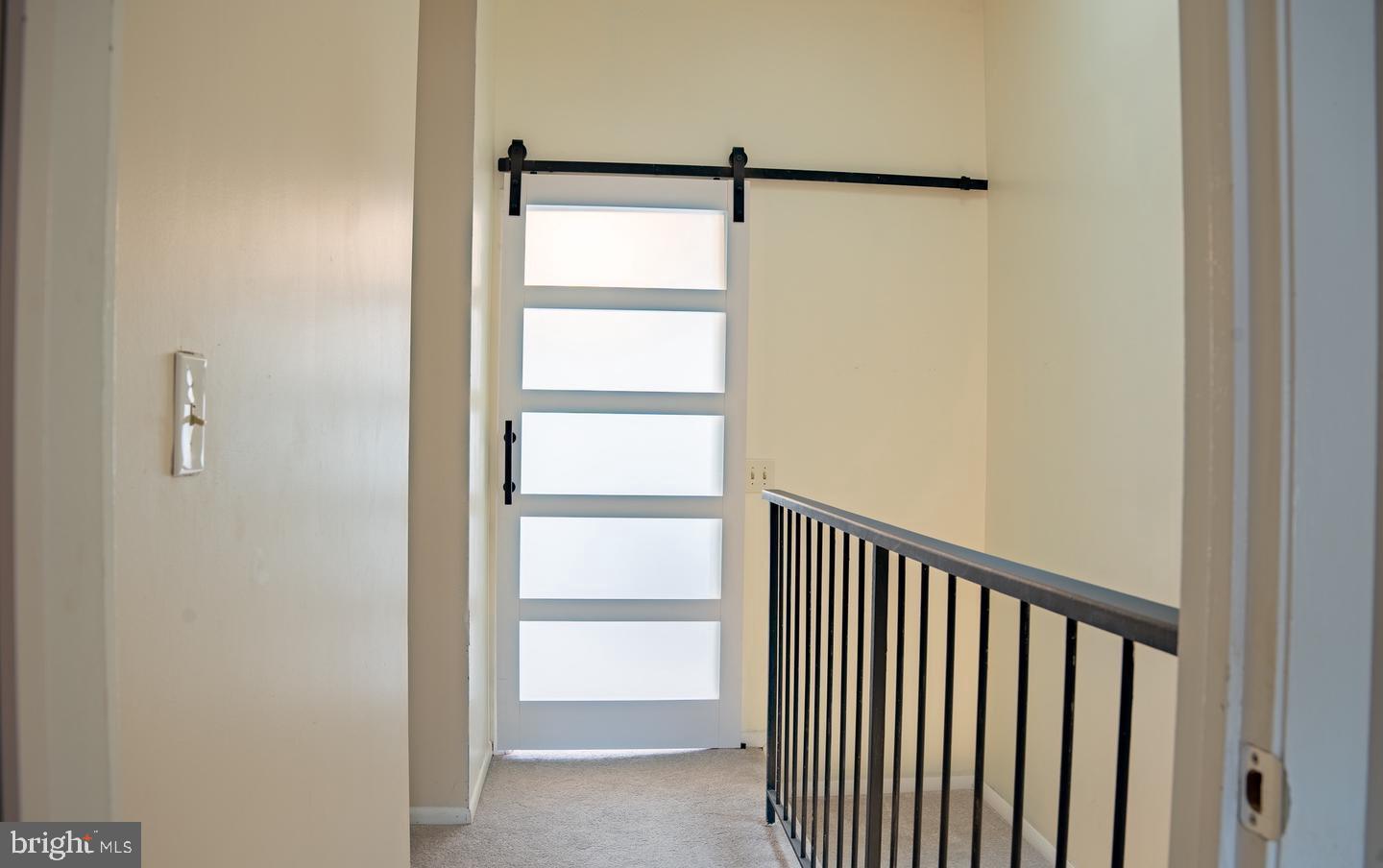 6907 Jones View Drive, Unit 3A Baltimore, MD 21209 - Photo 2 of 19 a view of a room with racks on the wall