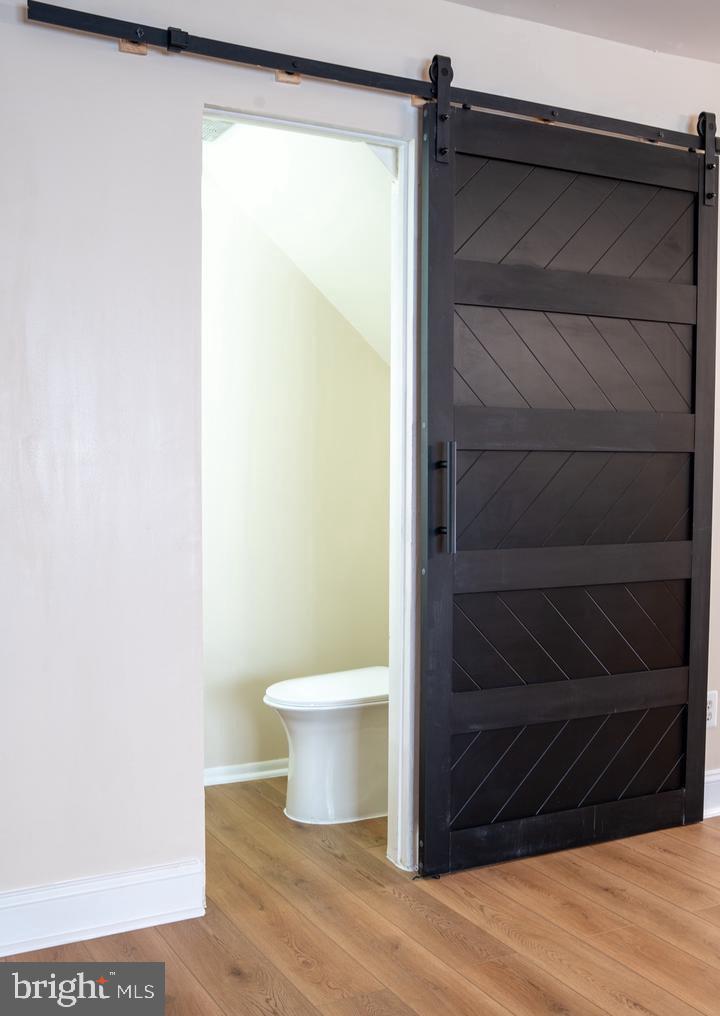 6907 Jones View Drive, Unit 3A Baltimore, MD 21209 - Photo 8 of 19 a bathroom with a toilet and a shower