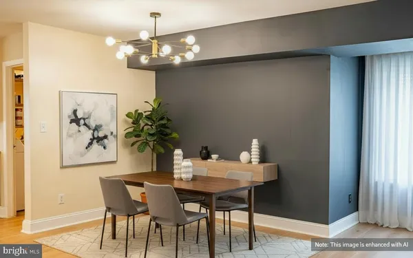 a dining room with furniture and chandelier