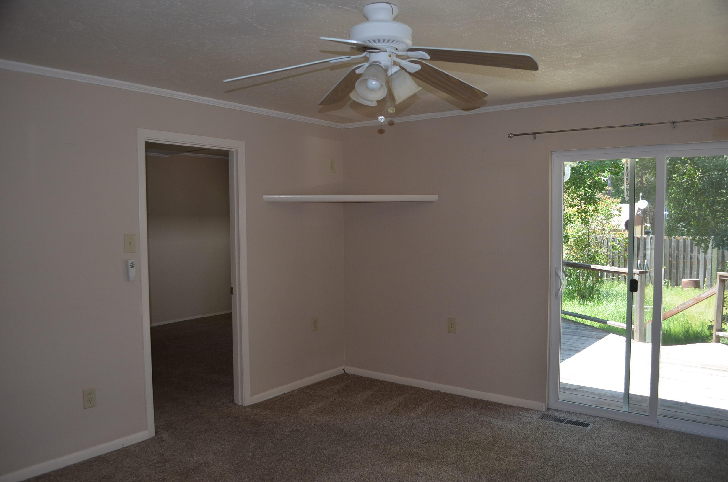 137008 Main Street Crescent, OR 97733 - Photo 32 of 50 an empty room with windows and fan