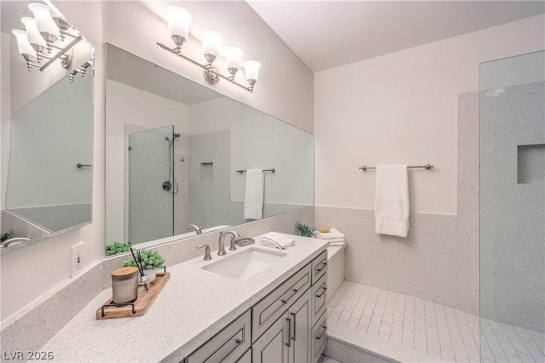 2050 West Warm Springs Road, Unit 1421 Henderson, NV 89014 - Photo 26 of 45 A well-appointed bathroom with a spacious vanity, sleek shower, and ample counter space.