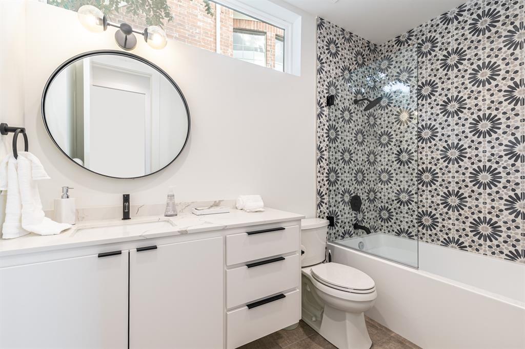 4202 Bonham Street Dallas, TX 75229 - Photo 20 of 32 Full bathroom with vanity, bathing tub / shower combination, and tile patterned floors