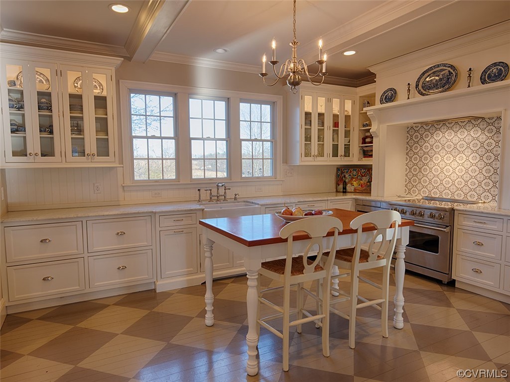1712 Novum Church Road Reva, VA 22735 - Photo 4 of 40 a kitchen with a dining table chairs cabinets and stainless steel appliances