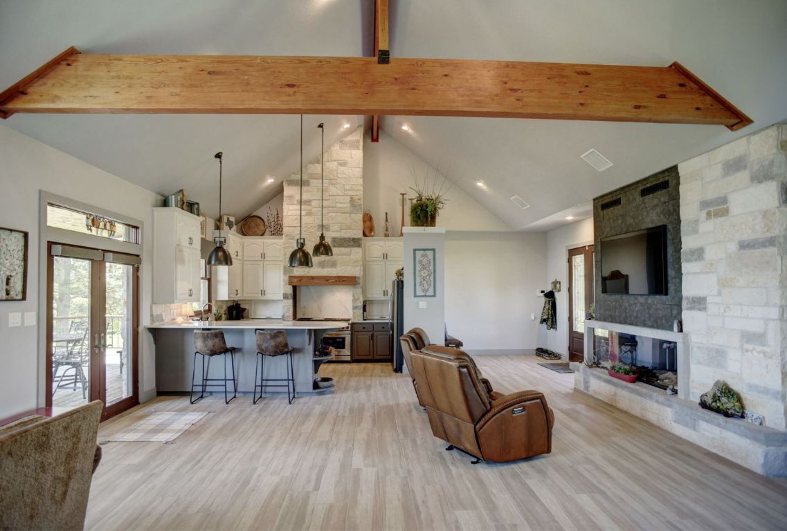 490 John Craft Road Red Rock, TX 78662 - Photo 15 of 40 a living room with furniture and a fireplace
