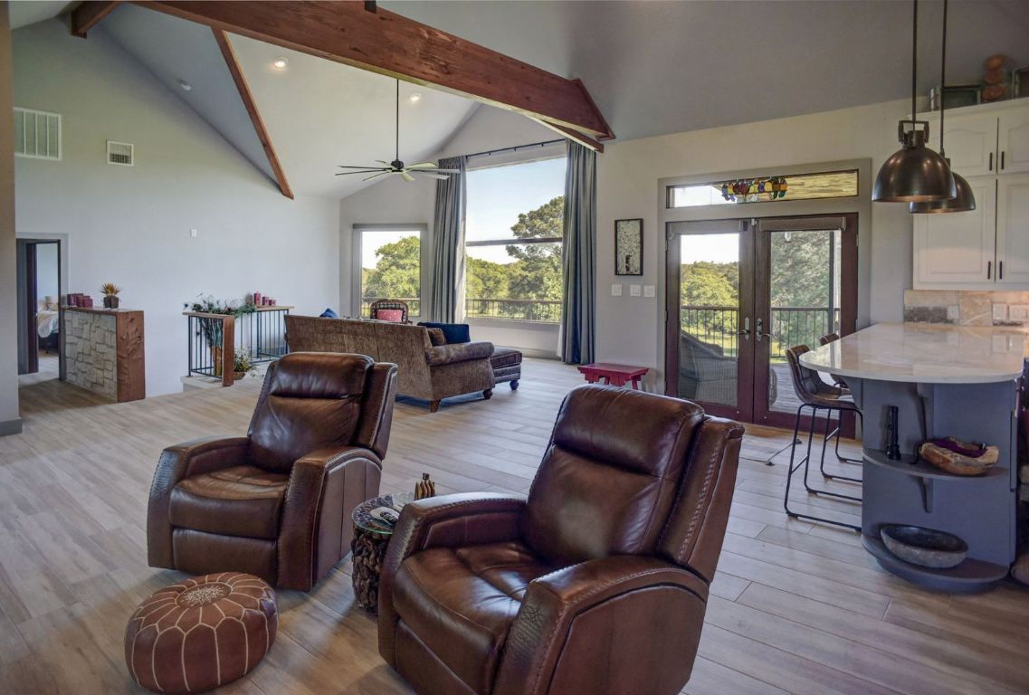 490 John Craft Road Red Rock, TX 78662 - Photo 16 of 40 a living room with furniture and a large window
