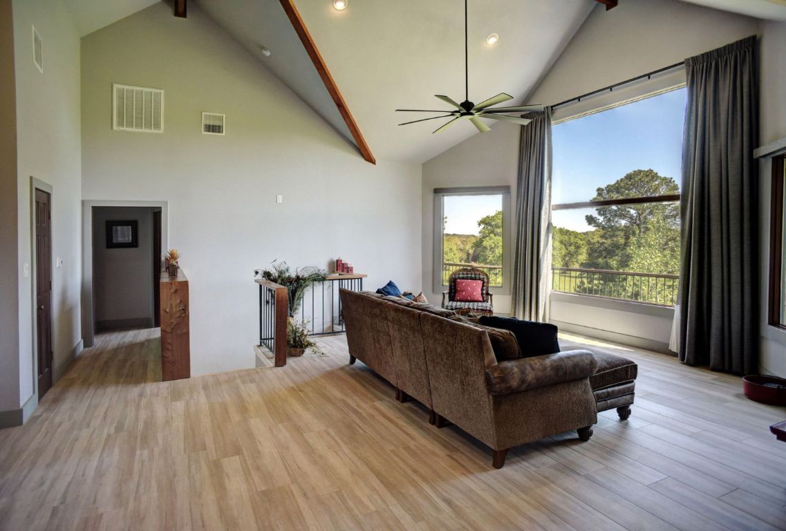 490 John Craft Road Red Rock, TX 78662 - Photo 17 of 40 a living room with furniture and a large window