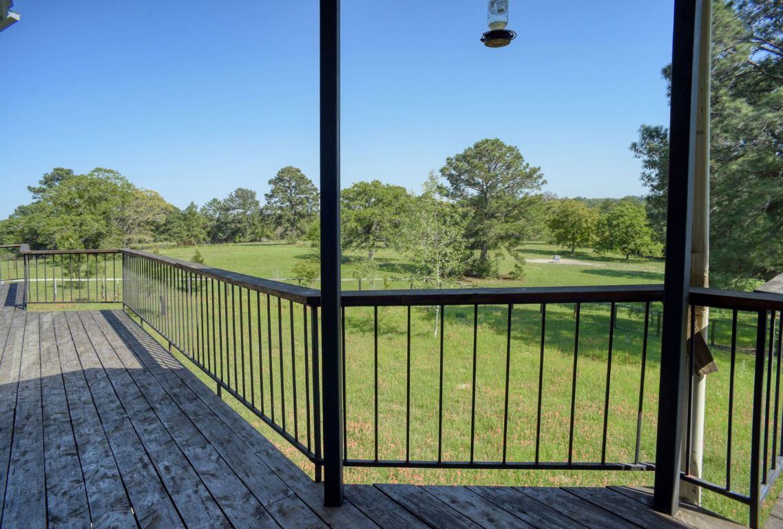 490 John Craft Road Red Rock, TX 78662 - Photo 20 of 40 a view of balcony with wooden floor