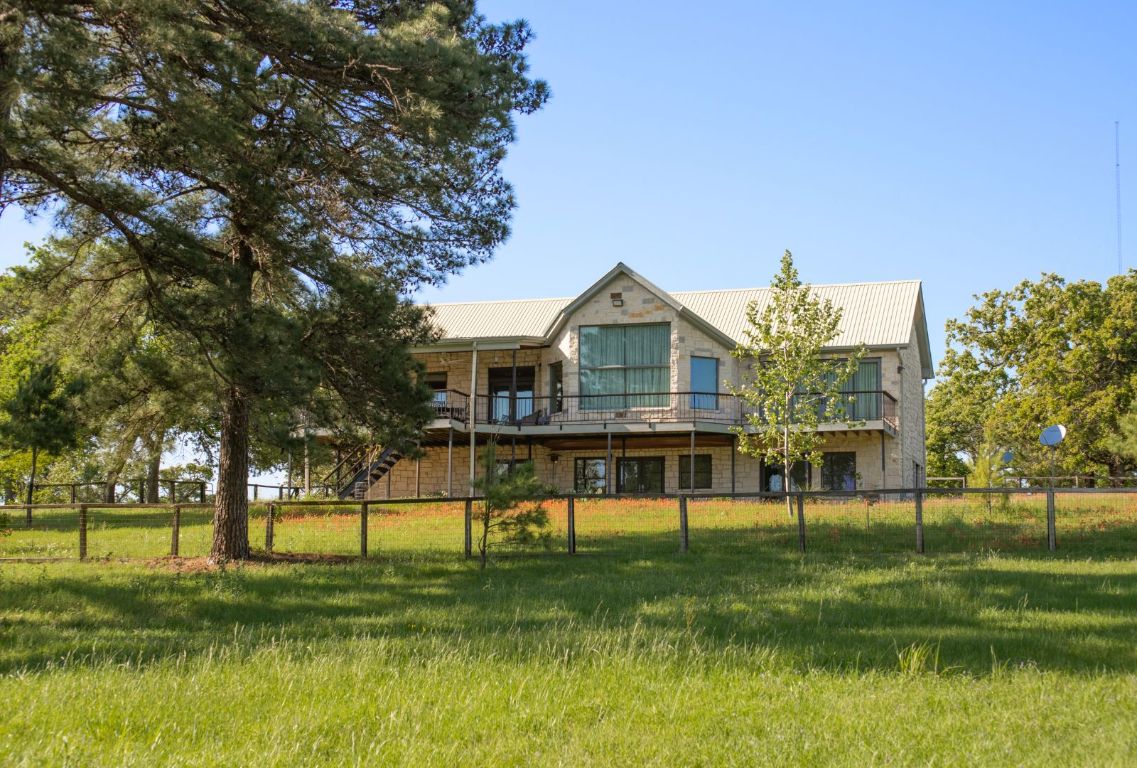 490 John Craft Road Red Rock, TX 78662 - Photo 2 of 40 a view of house with a yard