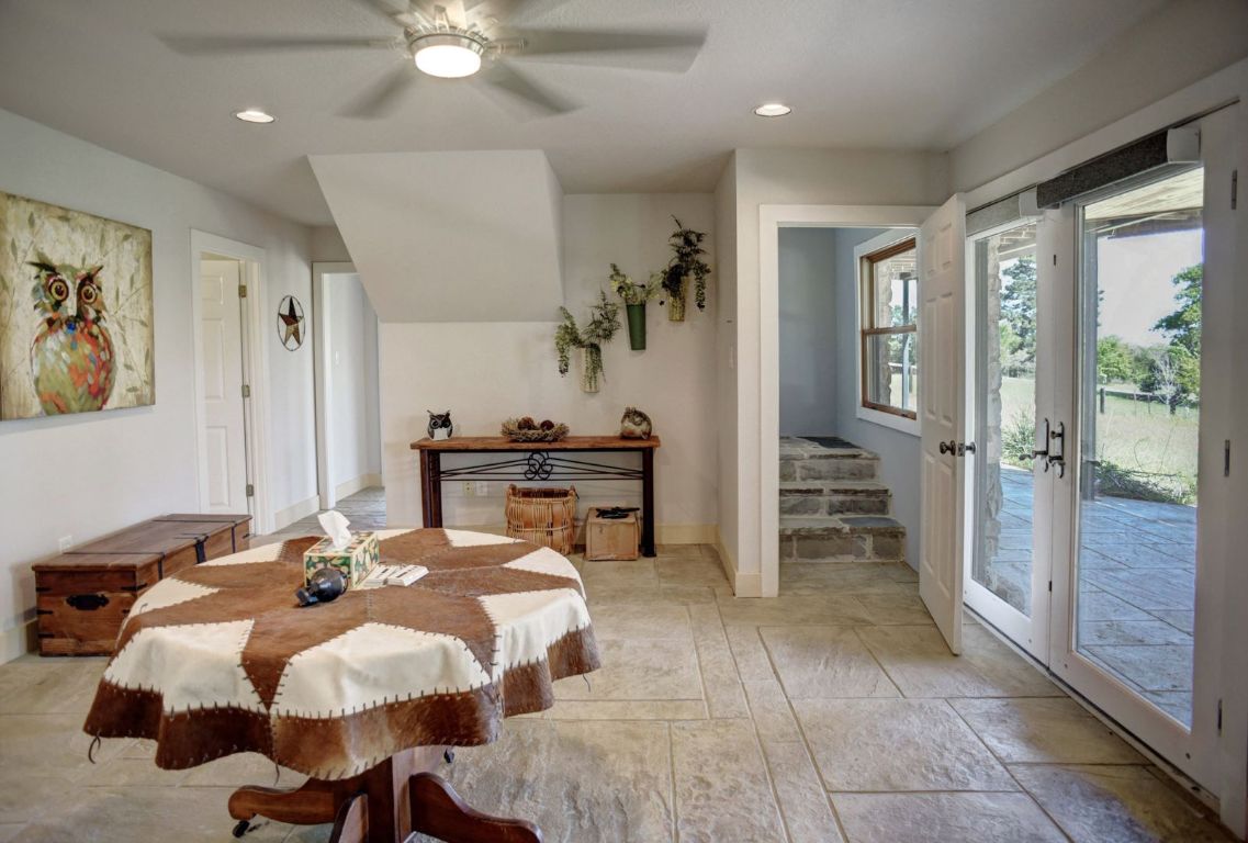 490 John Craft Road Red Rock, TX 78662 - Photo 22 of 40 a bed room with a bed and a chandelier