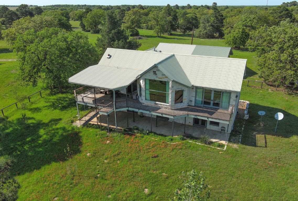 490 John Craft Road Red Rock, TX 78662 - Photo 28 of 40 an aerial view of a house with swimming pool garden and patio