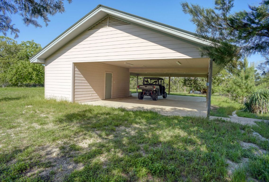 490 John Craft Road Red Rock, TX 78662 - Photo 30 of 40 a view of a house with yard and sitting area