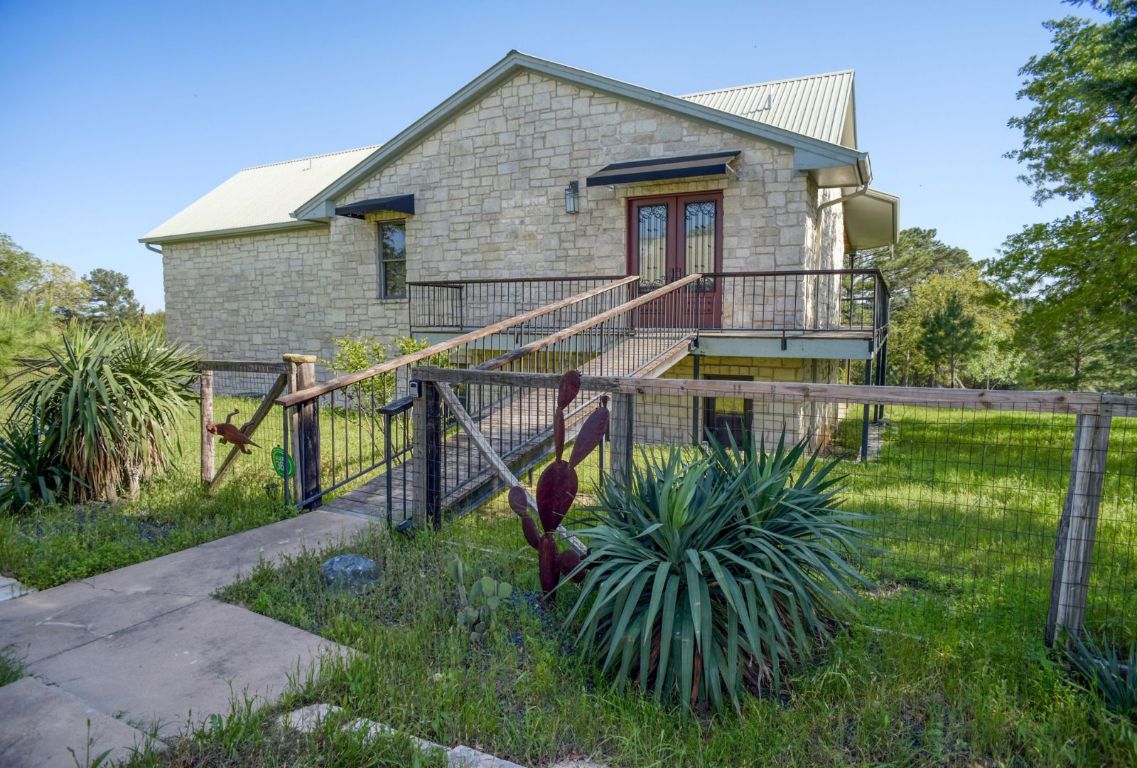 490 John Craft Road Red Rock, TX 78662 - Photo 3 of 40 a view of a house with a yard