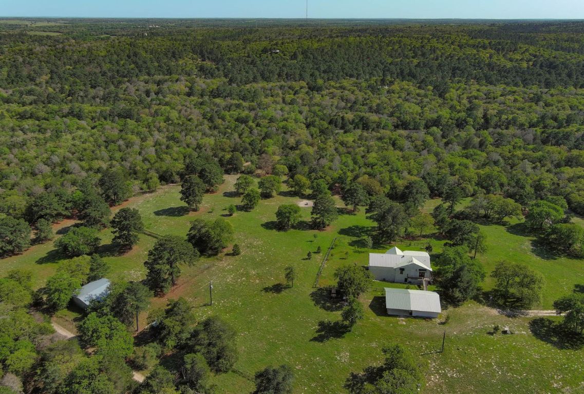 490 John Craft Road Red Rock, TX 78662 - Photo 34 of 40 an aerial view of residential house with outdoor space