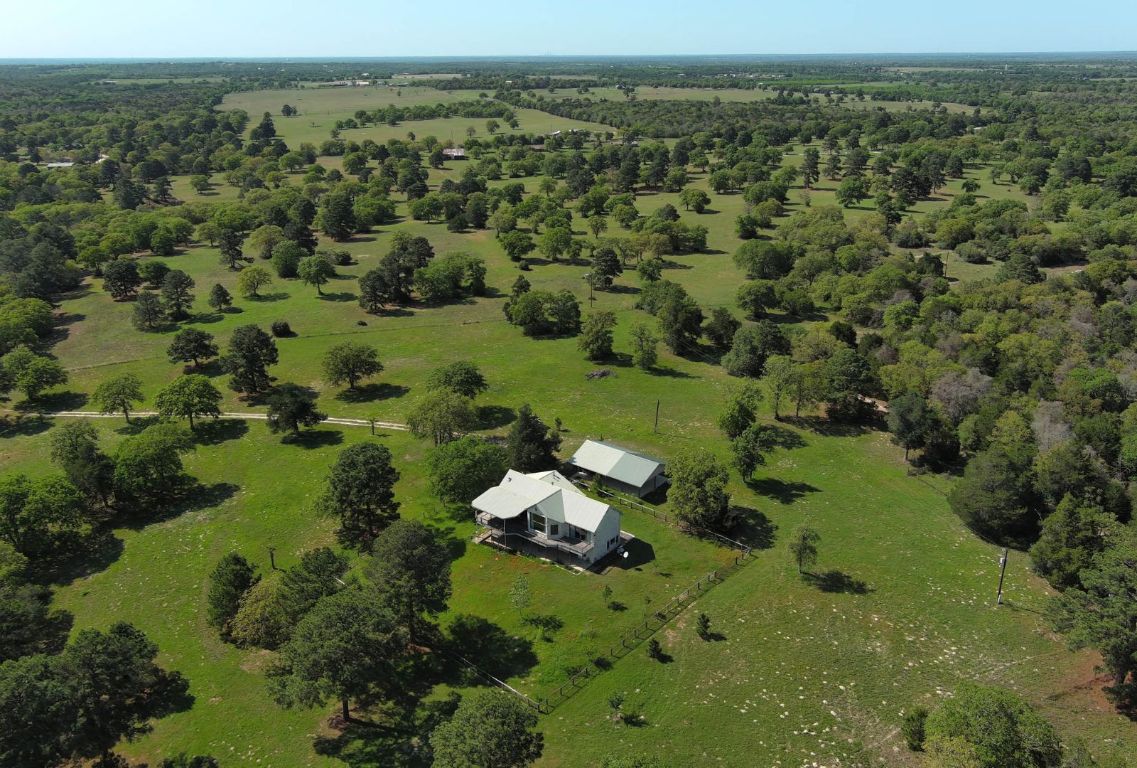 490 John Craft Road Red Rock, TX 78662 - Photo 40 of 40 an aerial view of a houses with a yard