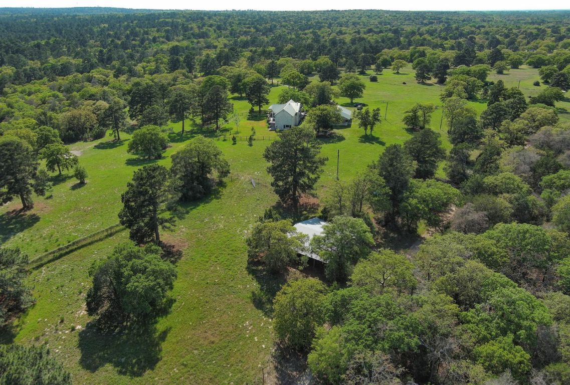 490 John Craft Road Red Rock, TX 78662 - Photo 4 of 40 an aerial view of residential houses with outdoor space and trees