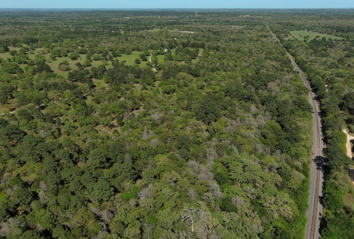 490 John Craft Road Red Rock, TX 78662 - Photo 5 of 40 an aerial view of residential houses with outdoor space and trees