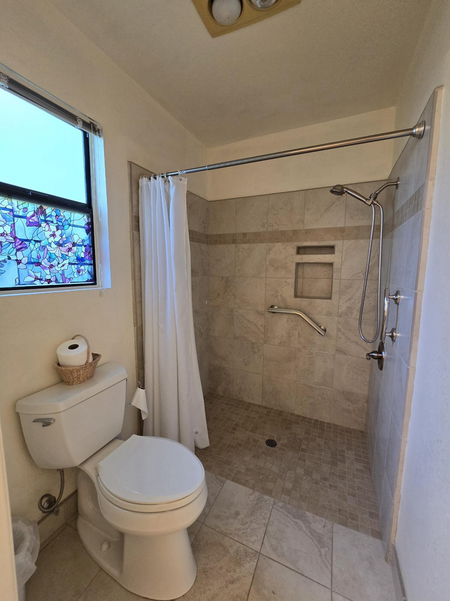 3671 Santa Rosa Way Redding, CA 96003 - Photo 14 of 26 a bathroom with a toilet and a shower