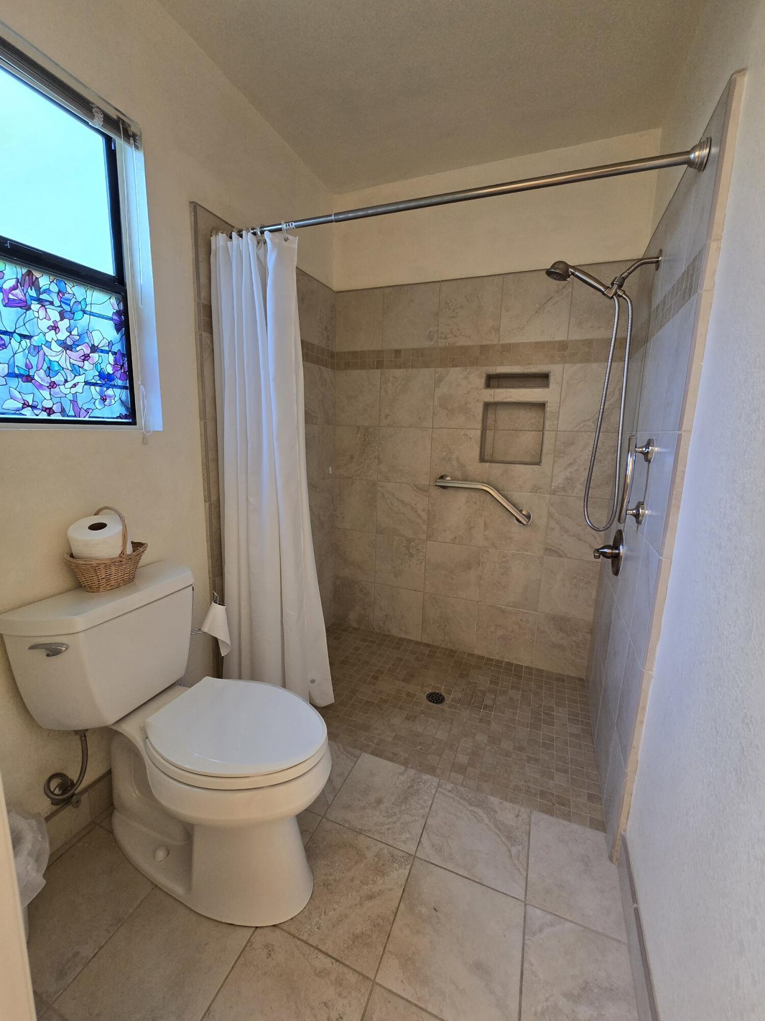 3671 Santa Rosa Way Redding, CA 96003 - Photo 15 of 26 a bathroom with a toilet and a shower