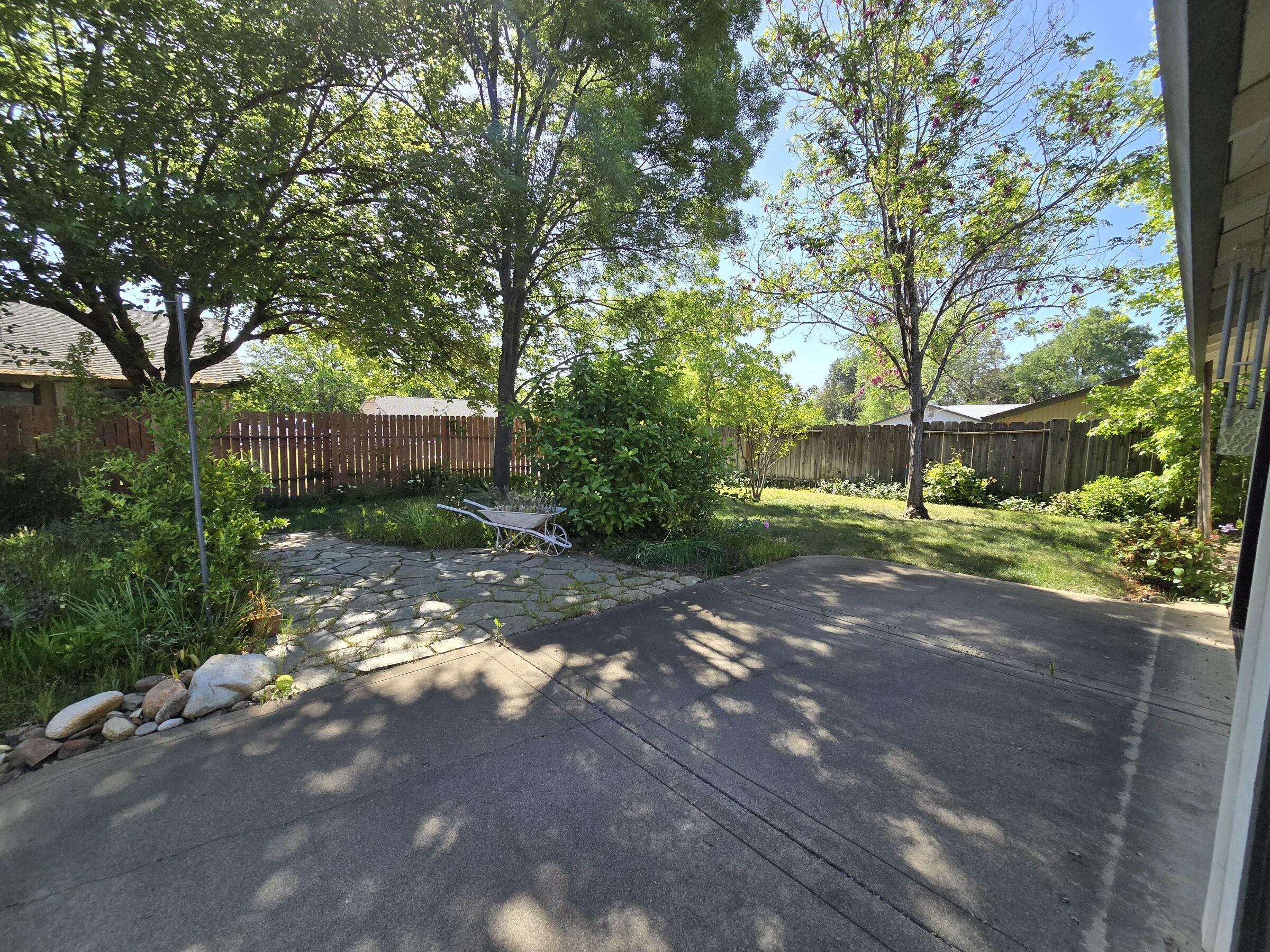 3671 Santa Rosa Way Redding, CA 96003 - Photo 18 of 26 a view of a street with a tree
