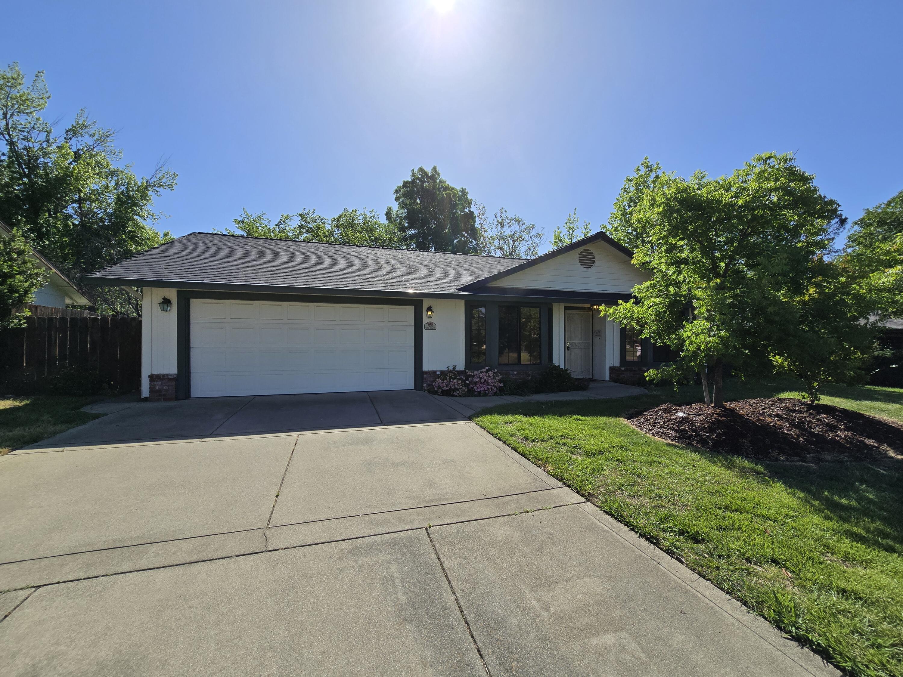 3671 Santa Rosa Way Redding, CA 96003 - Photo 2 of 26 front view of a house with a yard