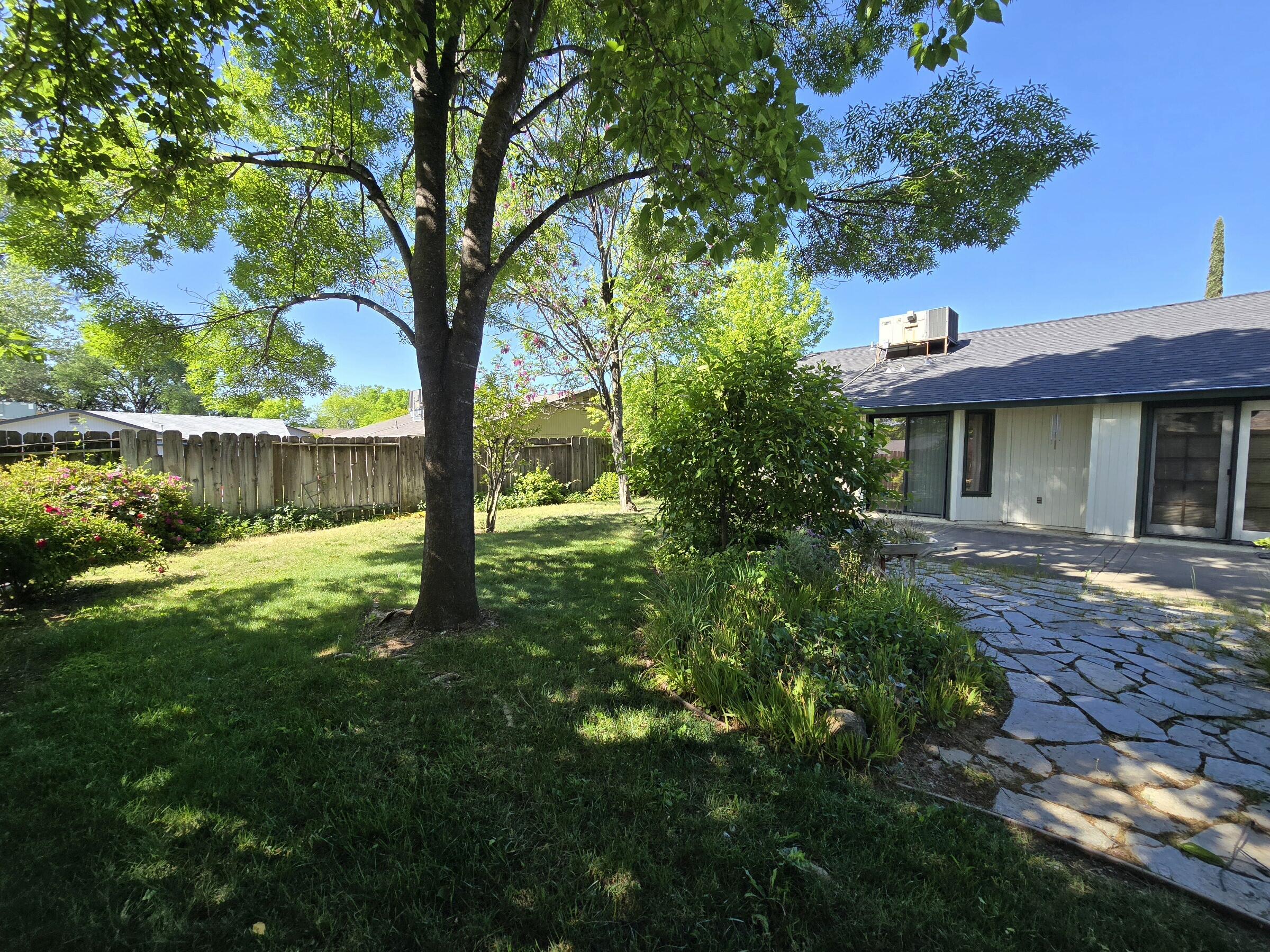 3671 Santa Rosa Way Redding, CA 96003 - Photo 21 of 26 a front view of a house with a yard