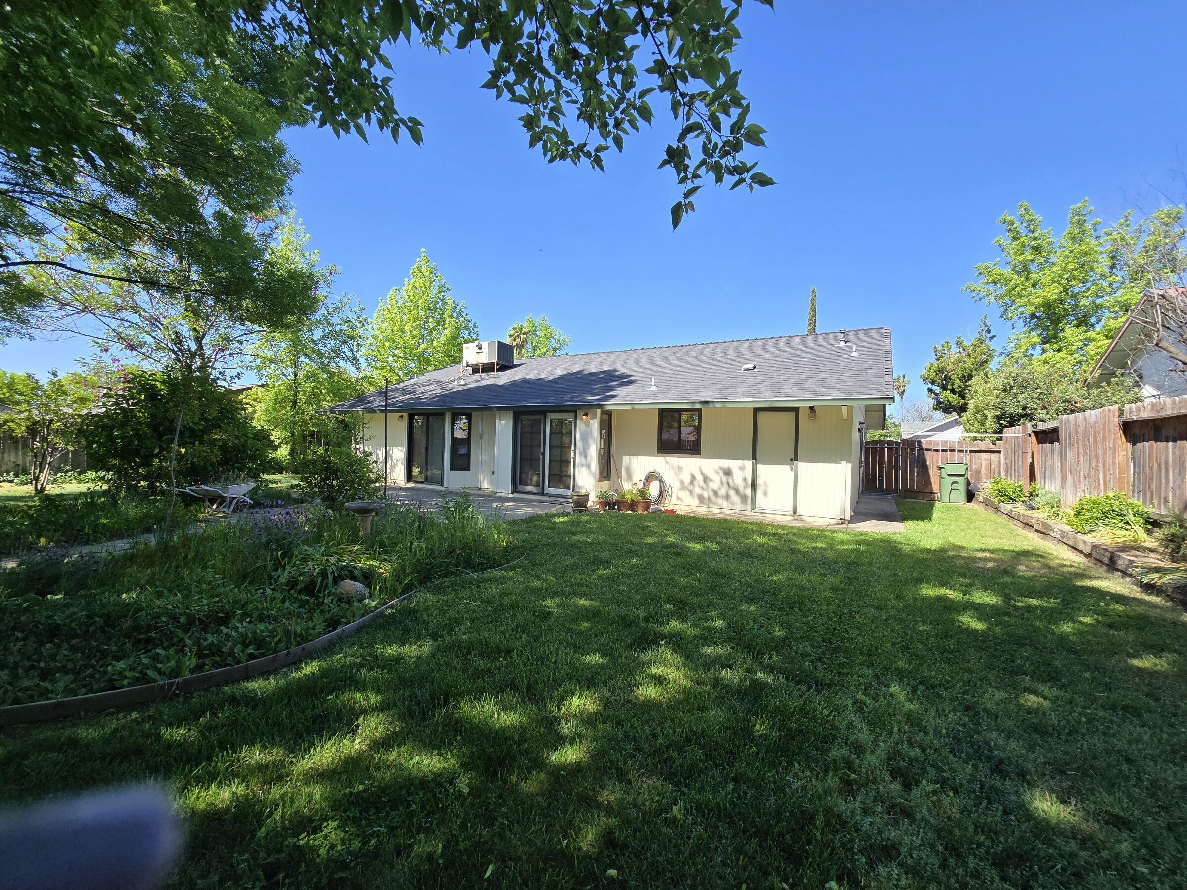 3671 Santa Rosa Way Redding, CA 96003 - Photo 23 of 26 a view of a house with a yard