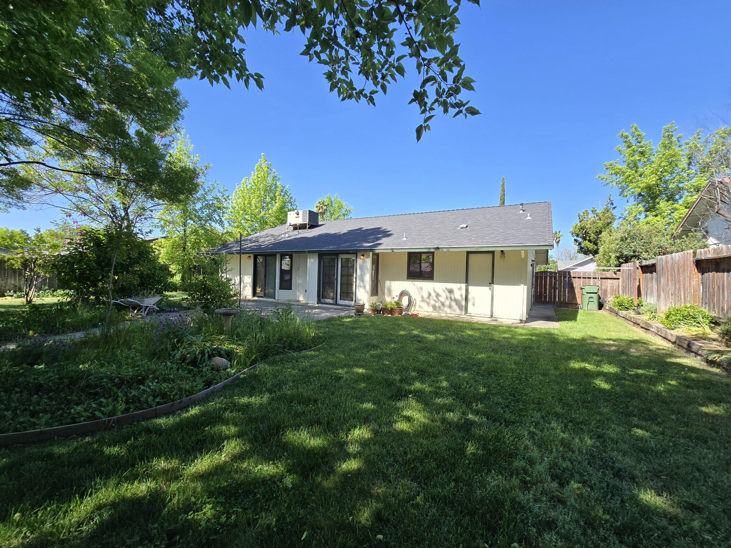 3671 Santa Rosa Way Redding, CA 96003 - Photo 24 of 26 a view of a house with a yard