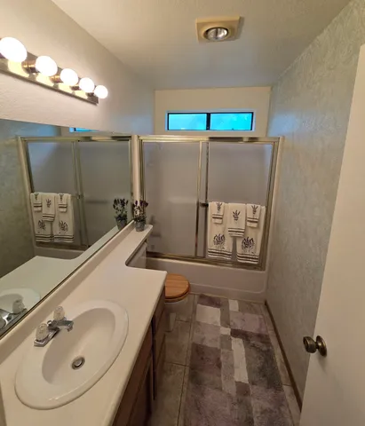 a bathroom with a sink and mirror
