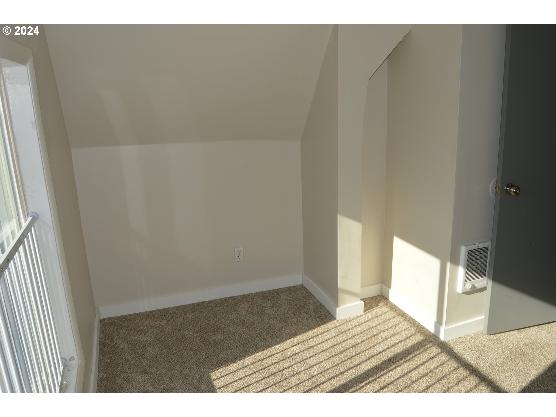 705 Couch Avenue Wallowa, OR 97885 - Photo 11 of 35 a view of an empty room and wooden floor