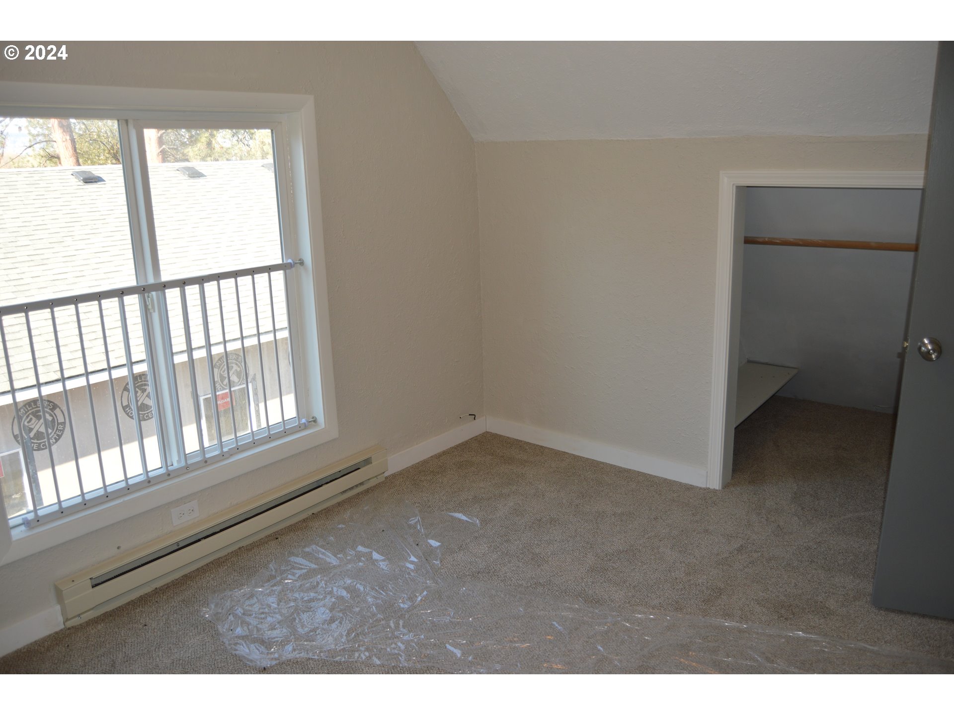 705 Couch Avenue Wallowa, OR 97885 - Photo 13 of 35 a view of an empty room and window