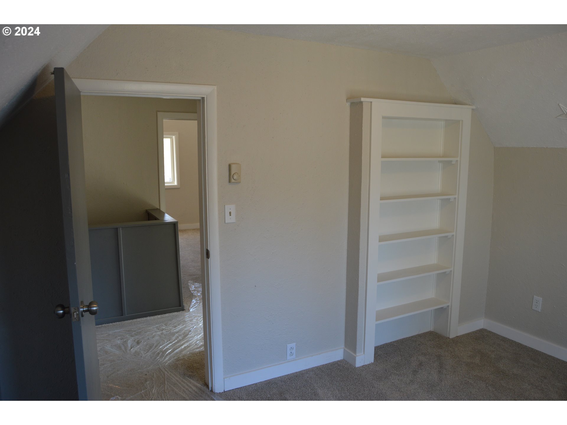 705 Couch Avenue Wallowa, OR 97885 - Photo 14 of 35 a view of hallway with wooden floor