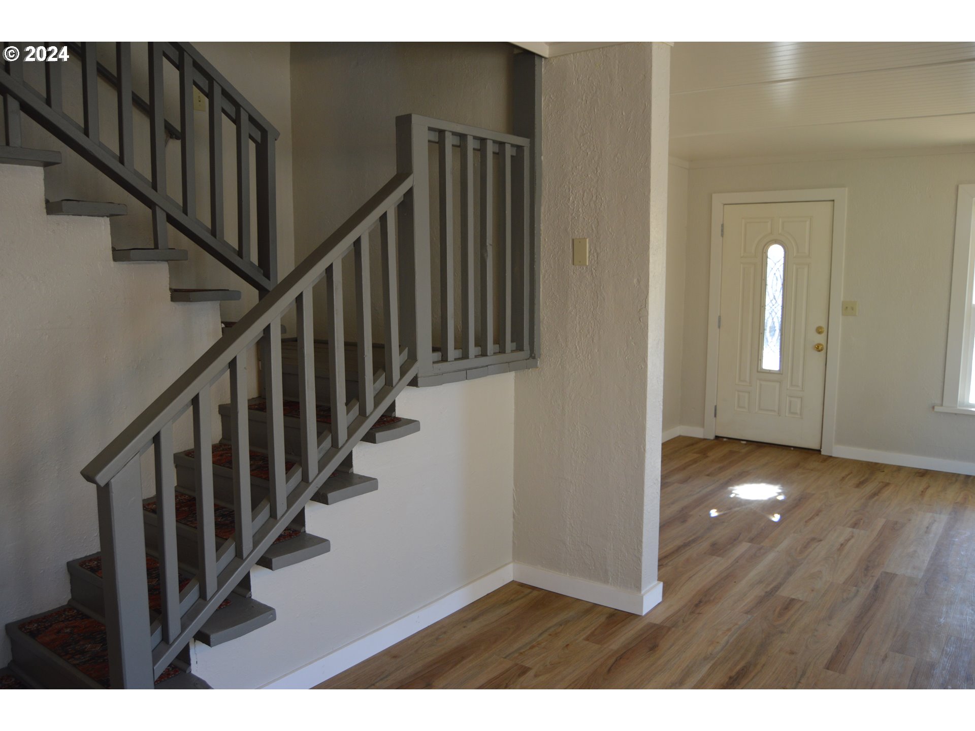 705 Couch Avenue Wallowa, OR 97885 - Photo 20 of 35 a view interior of a house with wooden floor and stairs