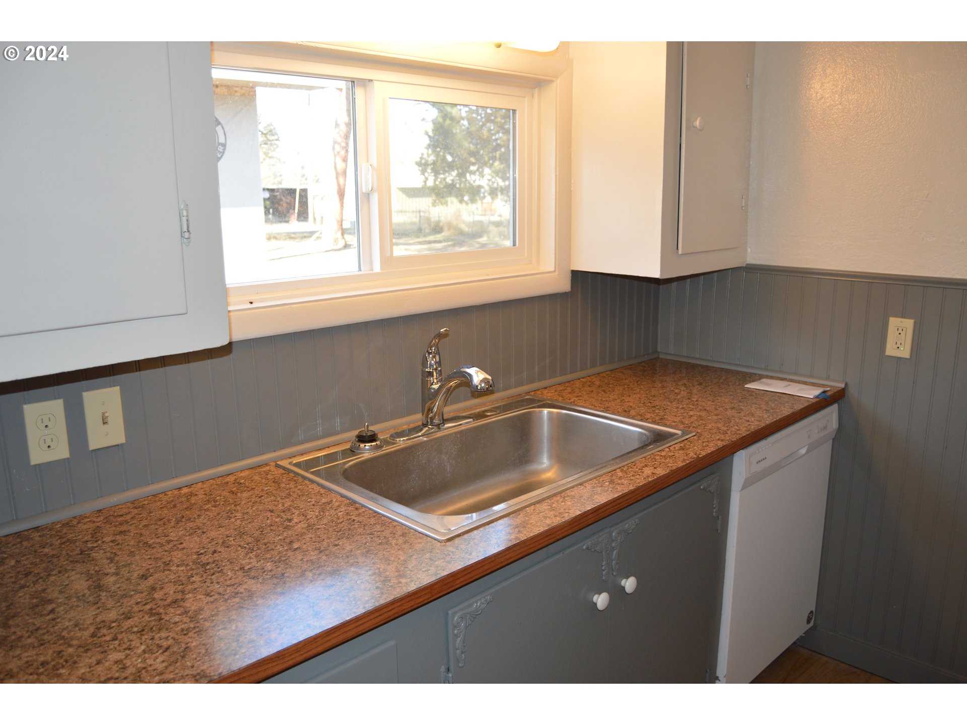 705 Couch Avenue Wallowa, OR 97885 - Photo 24 of 35 a kitchen with a sink and cabinets
