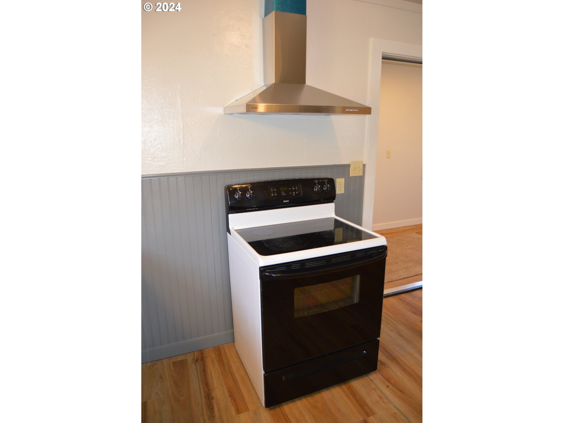 705 Couch Avenue Wallowa, OR 97885 - Photo 25 of 35 a stove top oven sitting inside of a kitchen