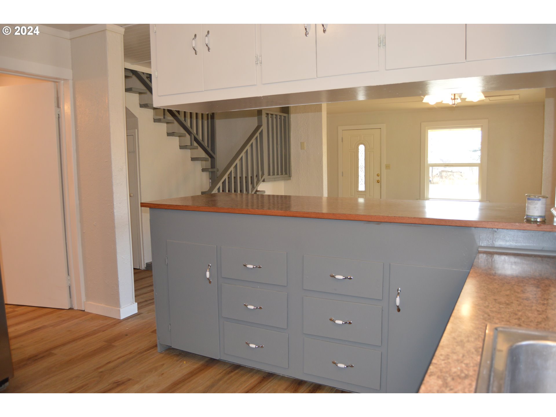 705 Couch Avenue Wallowa, OR 97885 - Photo 27 of 35 a view of room with window and wooden floor