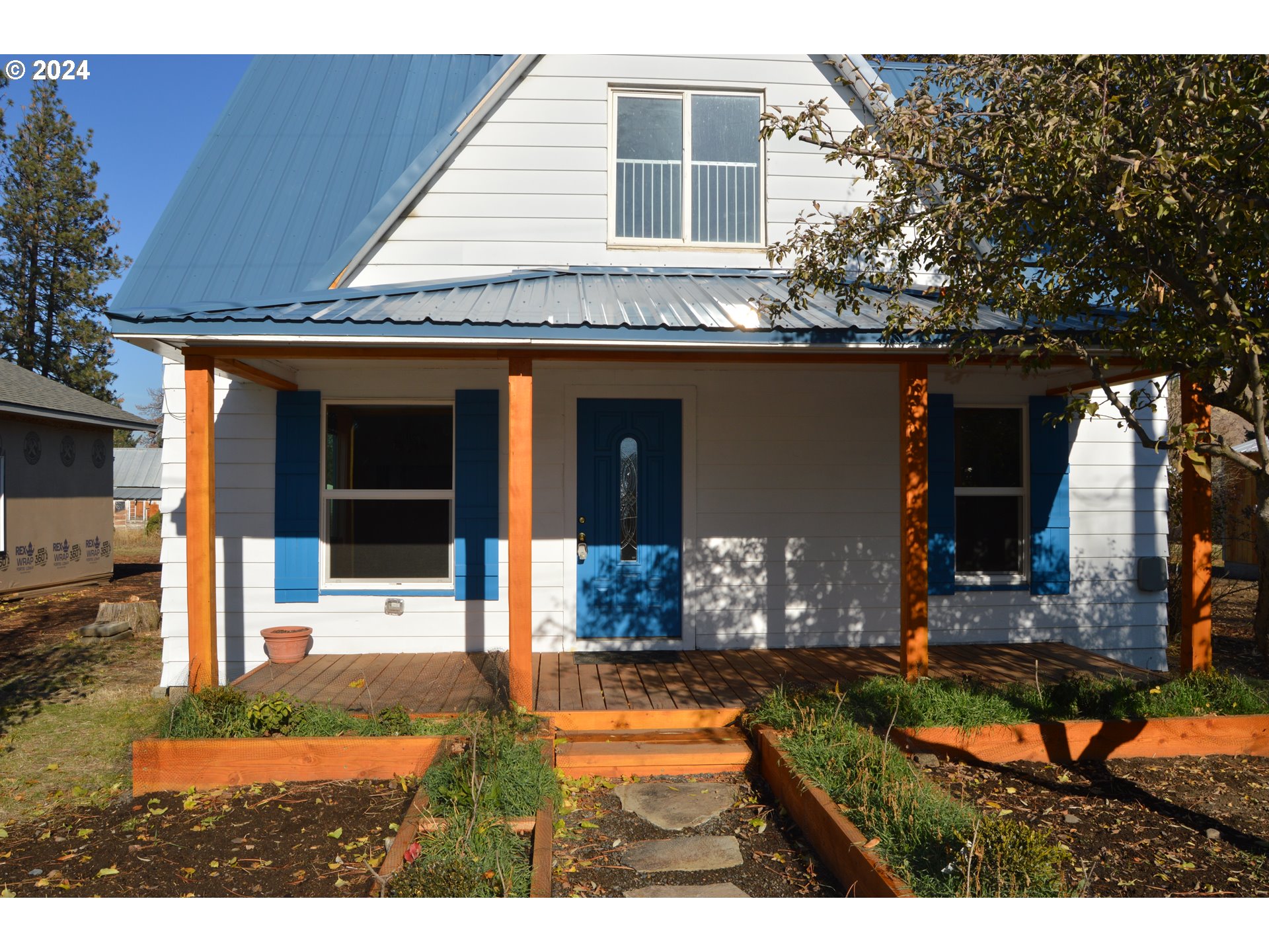 705 Couch Avenue Wallowa, OR 97885 - Photo 32 of 35 a view of a house with backyard and sitting area